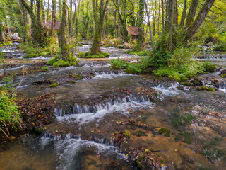 Cascades on the Janj mountain stream in the forest, painted with autumn colors near Sipovo. - Image