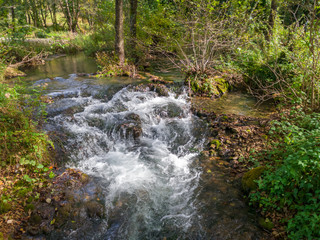 Cascades on the Janj mountain stream in the forest, painted with autumn colors near Sipovo. - Image