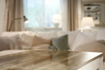 Table background of free space and blurred home interior and window sill 
