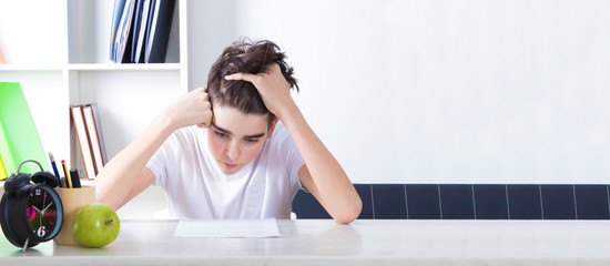 student at the desk with clock and space for text