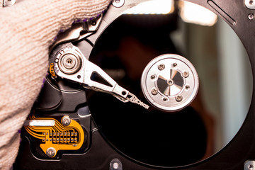 Disassembled hard drive from the computer, hdd with mirror effect. Opened hard drive from the...