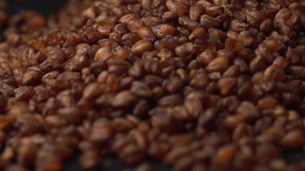 Buckwheat tea lies on a black table on black background. Beautiful view of buckwheat tea.