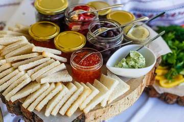 Beautifully decorated catering banquet table with different food snacks and appetizers with sandwich