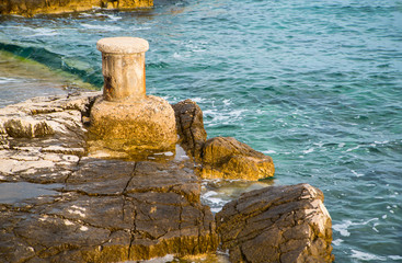 rocky shore near the sea. the beginning of the tourist season.