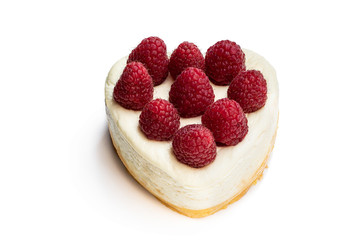 Heart shaped cheesecake with raspberry isolated on white. Top view