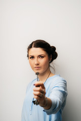 Pretty brunette girl holding keys in his hand