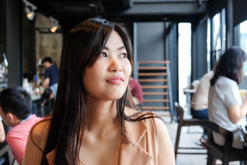 Business asian women smiling in city restaurant modern cafe