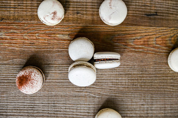 Several pieces of delicious French cookie - macrons. Chocolate flavor.
