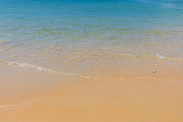 Fototapeta na wymiar Clear water sand beach and blue sky