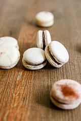 Several pieces of delicious French cookie - macrons. Chocolate flavor.