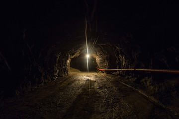 Underground gold quartz mine shaft tunnel drift with light