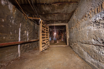 Underground gold mine tunnel with door