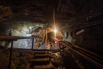 Underground gold quartz mine incline tunnel with stairs ladder