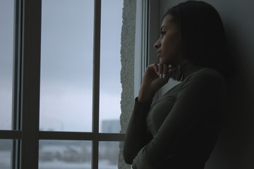 Sad Black Girl In The Dark Near The Window