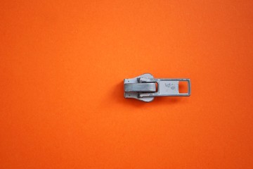 metallic zipper on the orange background