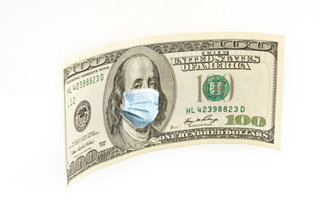 One Hundred Dollar Bill With Medical Face Mask on Benjamin Franklin