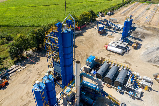 Aerial view of heavy machinery for crushing and collecting stone, limestone, sand and gravel, materials for asphalt producers and paving road, construction