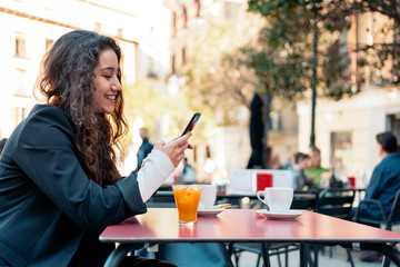 Young caucasian woman using smartphone