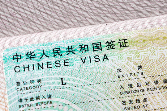 Chinese visa in the passport, close up. Travel Asia.