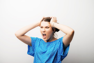 Fototapeta premium girl screaming holding her head