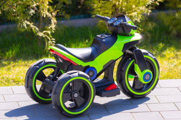 An electric motorcycle for kids in the garden