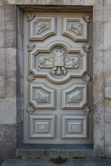 wooden door with a beautiful decorative metal lattice in the historic part of Lisbon