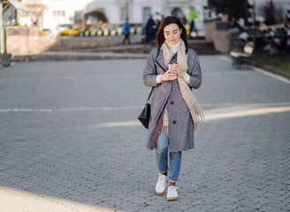 Fototapeta premium Woman portrait walking in the street