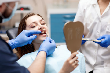 Patient's teeth shade with samples for bleaching treatment.
