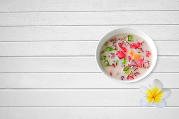 thai sweet Tub-Tim krob, on a white wooden table