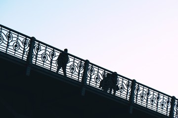 tourists walking across the bridge in Bilbao city, Spain