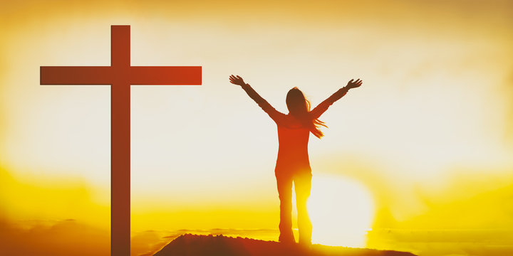 Easter Christian Cross Woman Praising The Lord With Hands Raised In Sunset Flare Glow Outside. Sunday Worship Service