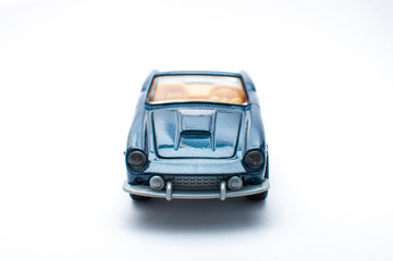 Blue toy car on white background