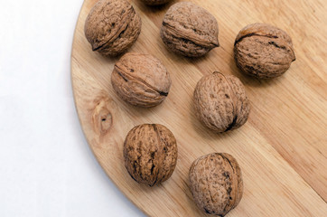 fresh walnuts, superfood, healthy foods, nuts on a wooden surface, close-up