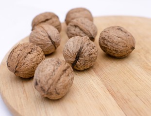 fresh walnuts, superfood, healthy foods, nuts on a wooden surface, close-up