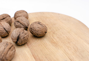 fresh walnuts, superfood, healthy foods, nuts on a wooden surface, close-up