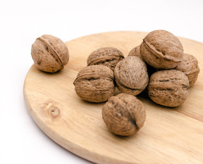 fresh walnuts, superfood, healthy foods, nuts on a wooden surface, close-up