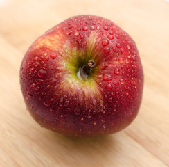 fresh red apples close-up on a light wooden background, healthy health products