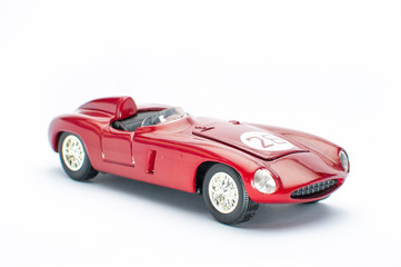 Red toy car on white background