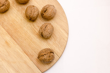 fresh walnuts, superfood, healthy foods, nuts on a wooden surface, close-up