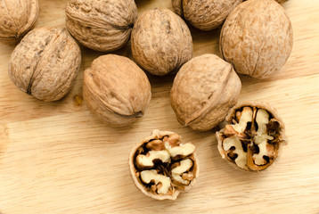 fresh walnuts, superfood, healthy foods, nuts on a wooden surface, close-up