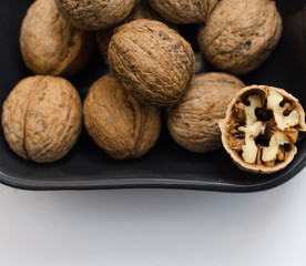 fresh walnuts, superfood, healthy foods, nuts on a wooden surface, close-up