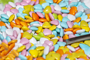 chocolate dragees in colored glaze