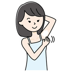 脇にデオドラントクリームを塗る女性