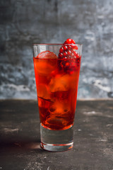 Pomegranate cocktail in highball glass. Selective focus. Shallow depth of field.