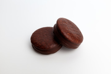 Chocolate coated pie on white background
