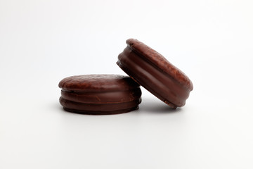 Chocolate coated pie on white background