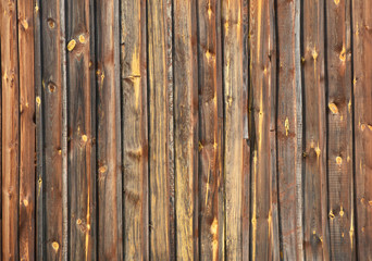 Brown vintage wooden knotty boards background.