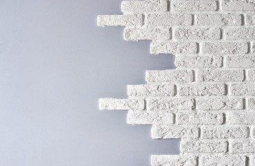 white brick protruding texture on a gray wall for design