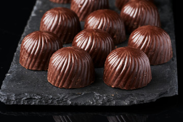 chocolate candies on black stone