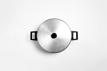 Aluminum cooking pan isolated on white background with clipping path. High-resolution photo.Top view.
